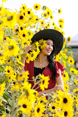 Portrait of happy asian woman in the cockscomb flower garden and relaxing on holiday