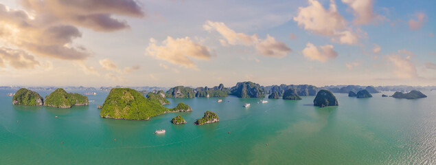 Aerial view panorama of floating fishing village and rock island, Halong Bay, Vietnam, Southeast Asia. UNESCO World Heritage Site. Junk boat cruise to Ha Long Bay. Popular landmark of Vietnam © galitskaya
