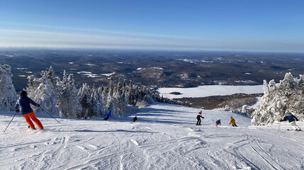 Skiers in Mont Tremblant summit, Quebec, Canada