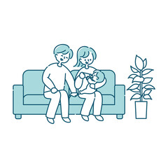 ソファーで赤ちゃんにミルクを飲ませる夫婦