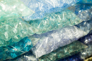 Stacks of blue crystals and pearls packages for bijou
