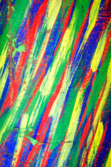 Background from different strokes of red, yellow, green and blue paint