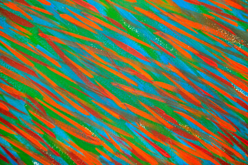 Bright varied background of colored lines of brush strokes made with paint