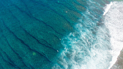 Surfers over Tropical Reef Aerial Drone View Ocean Reef Tunnels