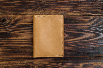 handmade leather accessory on wooden background