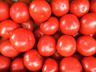 Tomatoes background. Red tomatoes. Ripe tomatoes.
