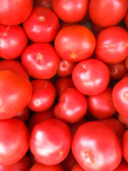 Tomatoes background. Red tomatoes. Ripe tomatoes.