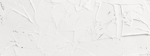 White abstract texture of surface covered with putty, panoramic image