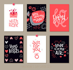 Set Valentine's Day greeting cards with lettering and decorative hand drawn love elements.