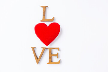 Love symbol, valentine card background idea, wooden love font with red heart isolate on white background