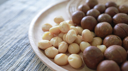 Organic Macadamia nut. macadamia nuts are cracked and baked to taste extremely delicious superfood fresh natural shelled unsalted raw macadamia and healthy food concept