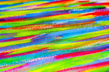 Background from different strokes of red, yellow, green and blue paint