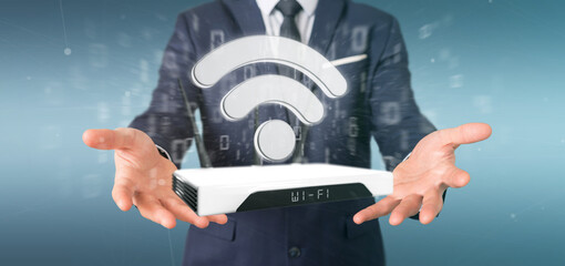 Businessman holding a Wifi router and data - 3d rendering