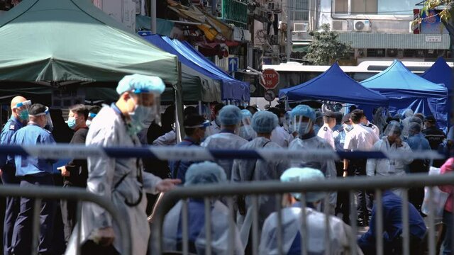 Health workers prepare for COVID-19 test for people in Hong Kong.
