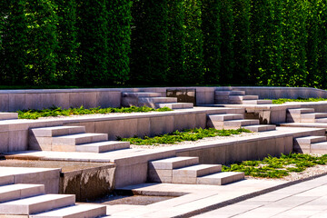 Rounded diagonal terraces on a slope in a modern city park