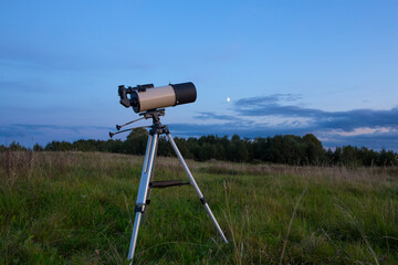 Telescope against the background of the evening sky.