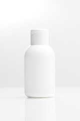 close up of a white bottle on white background. cosmetic mock up. branding identity mockup concept.