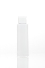 close-up of a white unbranded bottle on white background. cosmetic mock up. branding identity mockup concept.