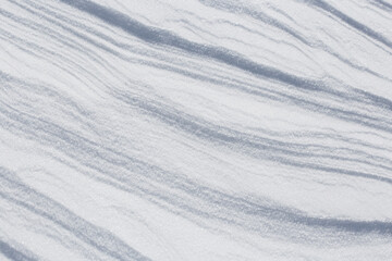 Fototapeta na wymiar Natural snowy background. Natural snowy surface.