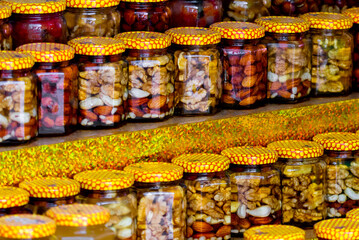 Canned nuts in jars. Autumn countryside fair healthy products