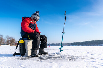 Boy enjoys winter fishing