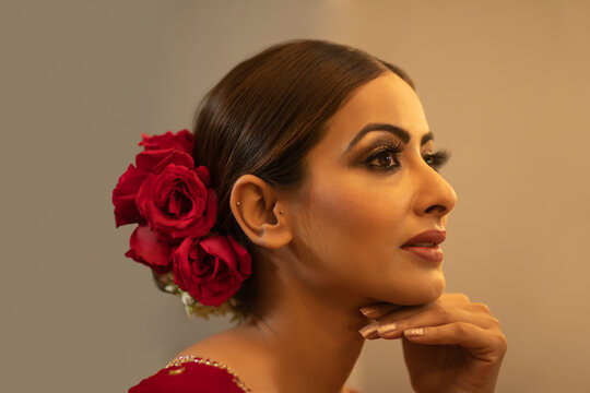Profile of an Indian bride during the make up session 	