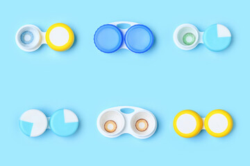 Containers with contact lenses on color background