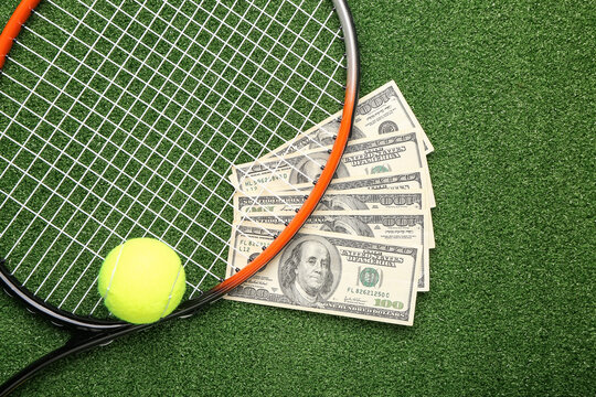 Money, tennis rocket and ball on color background. Concept of sports bet