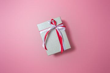 Silver gift boxs with bow on pink background top view, Valentines day, Flat lay style with copy space.