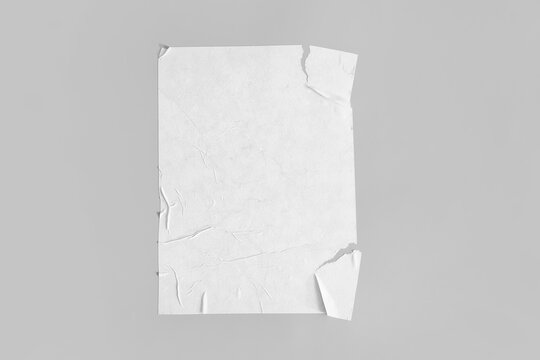 Blank creased paper sheet on grey background © Pixel-Shot