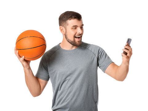 Young Man With Mobile Phone And Ball On White Background. Concept Of Sports Bet