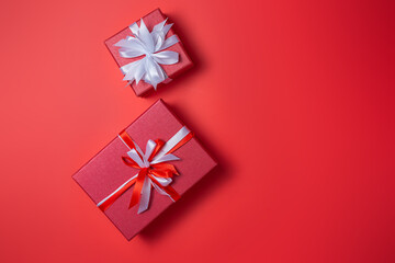 Double red gift box with bow on red background top view, Valentines day, Flat lay style with copy space