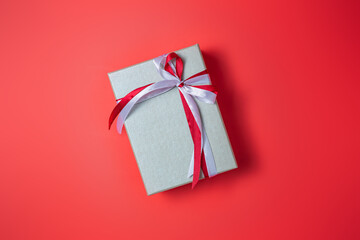 Silver gift boxs with bow on red background top view, Valentines day, Flat lay style with copy space.