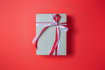 Silver gift boxs with bow on red background top view, Valentines day, Flat lay style with copy space.