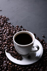Coffee cup and beans on old grey kitchen beton , rock table. with copyspace for your text