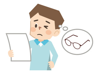 文字が読みにくい老眼の男性