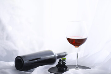 Glass with grape red semi-dry wine. Valentine's day concept background. Gift for the holiday. Sweet...