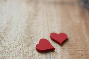 Two red Hearts for Valentine`s day concept on wood background. Love background