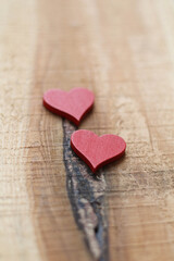 Two red Hearts for Valentine`s day concept on wood background. Love background