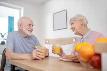 Senior couple having breakfast and looking peaceful