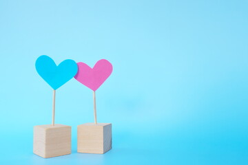 Pink and blue heart shape icon cutout together with copy space. Valentine's Day celebration, marriage, couple and love concept.