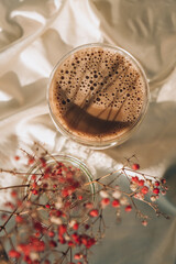 Cup of latte cappuccino. Morning coffee aesthetics vibes. Breakfast. Pink gypsophila flowers