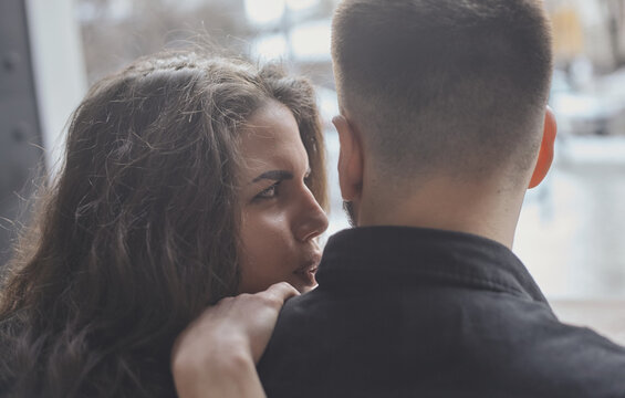 Excited To Be Together. Lovely Young Couple Sit At The Street Caffee