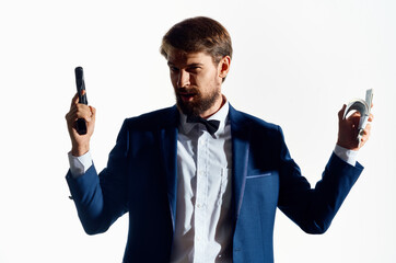 man in suit gun money gangster business light background