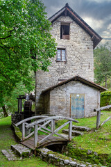 Fototapeta na wymiar Ancient watermill in the Dolomites mountains