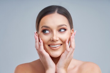 Portrait of beautiful woman on gray background