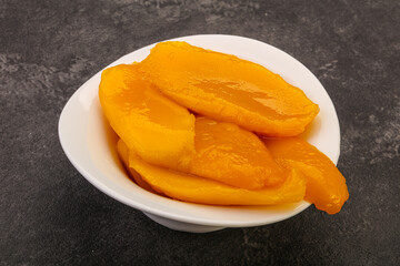 Sweet mango slices in syrop