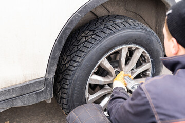 Naklejka premium Changing wheel on a car