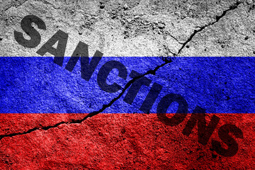 The flag of the Russian Federation on a cracked cement wall with the words 