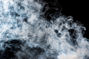 Obraz premium gray smoke with a blue tint on a black background